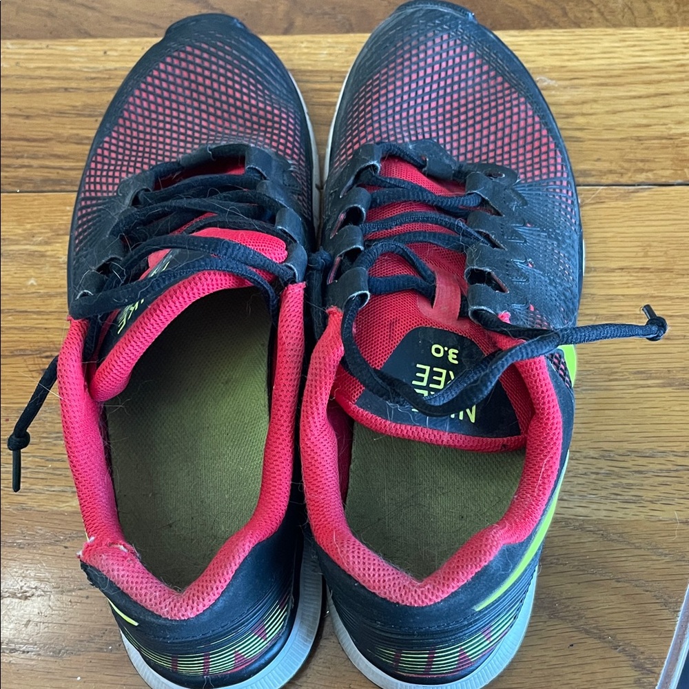 Nike Black and Red Running Shoes with Neon Accents